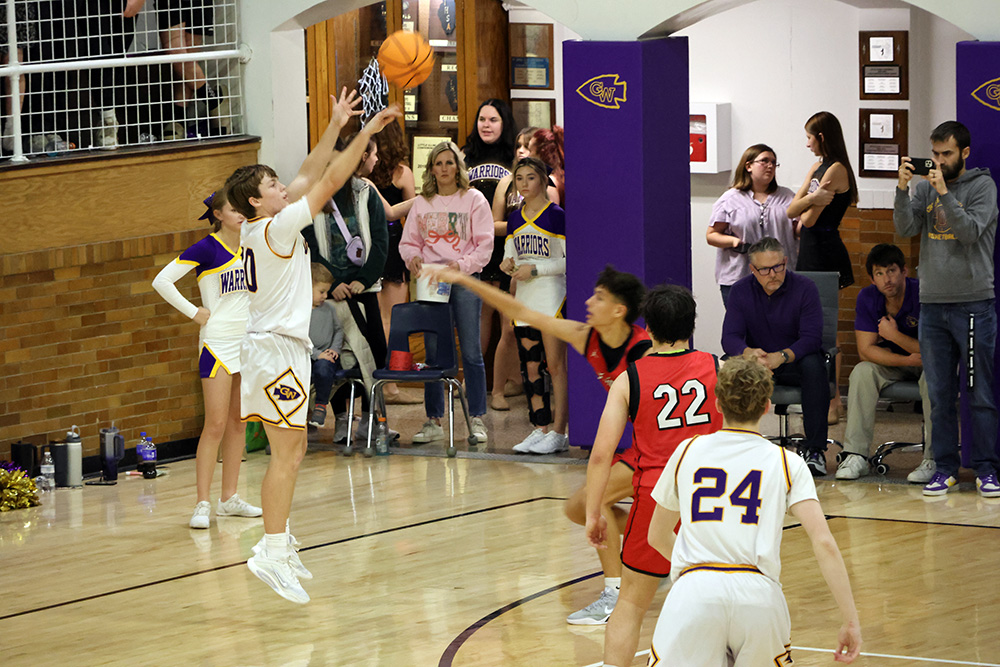 Varsity Warrior Jack Julius connects from long range during Casey-Westfield’s 48-40 victory over Fairfield. —photo by Terri Cox