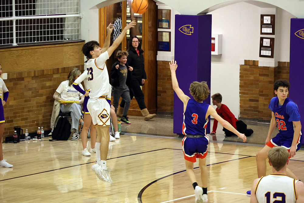 Leighton Jones puts up a shot during a dominant first-half performance against Cisne. Jones scored a career-high 30 points, all in the first two quarters of the home opener. —photo by Terri Cox